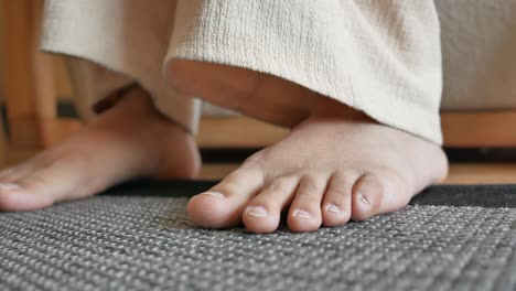 barefoot person on a carpet