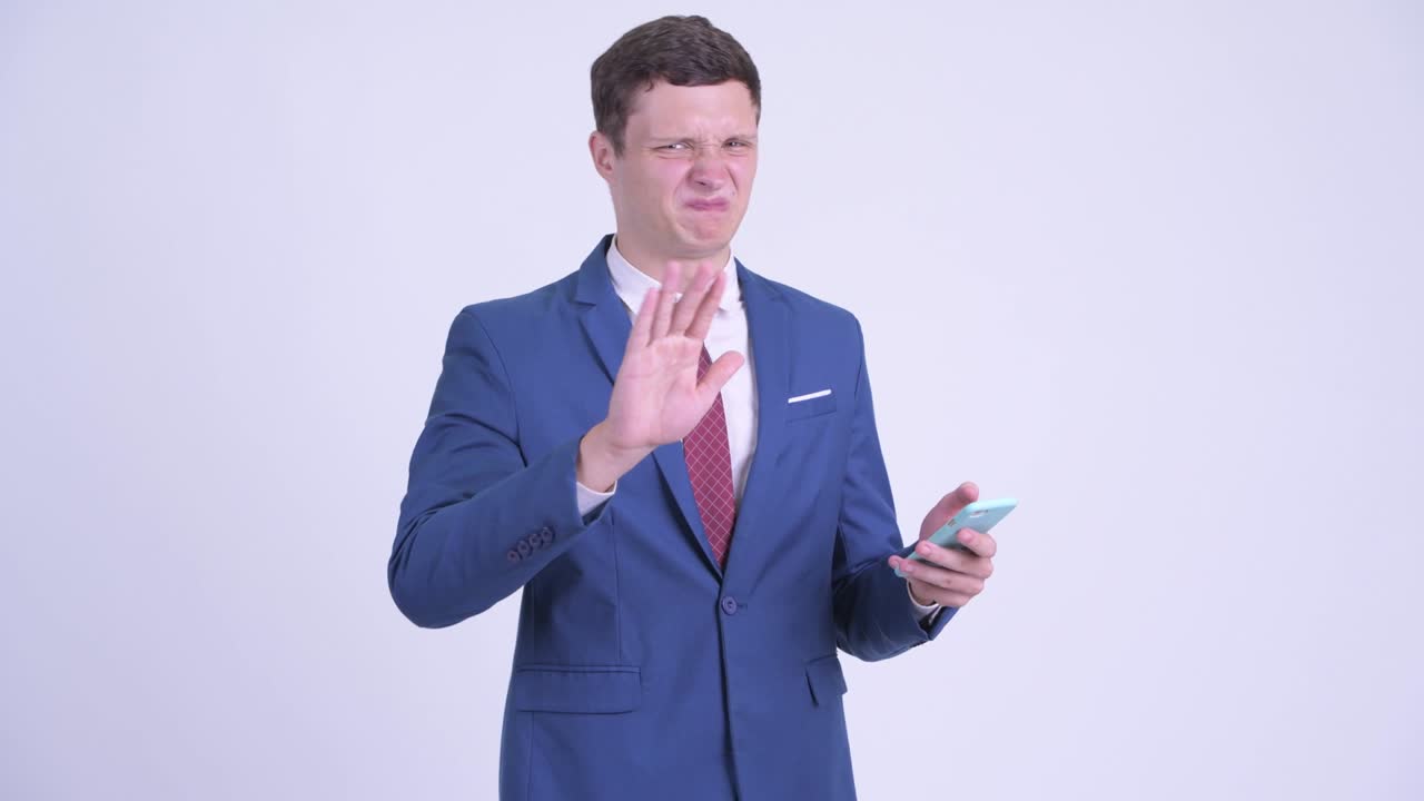 Young handsome businessman with phone