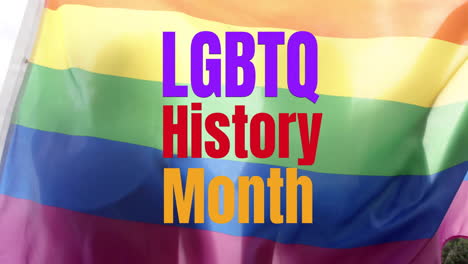 rainbow flag background with text animation celebrating lgbtq history month