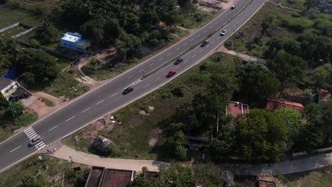 aerial drone shot of car follow-up in chennai highway