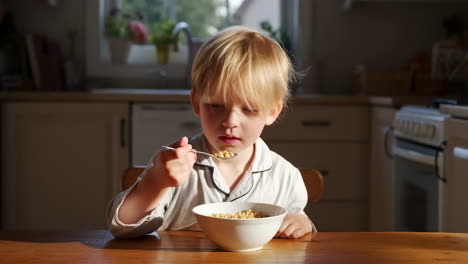 child eating cereal for breakfast