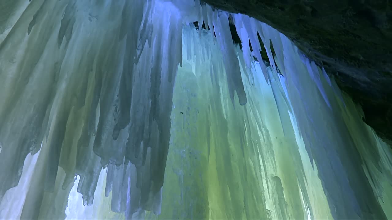 Vertical Ice Walls Inside The Eben Ice Caves In Michigan, USA. - tilt up shot
