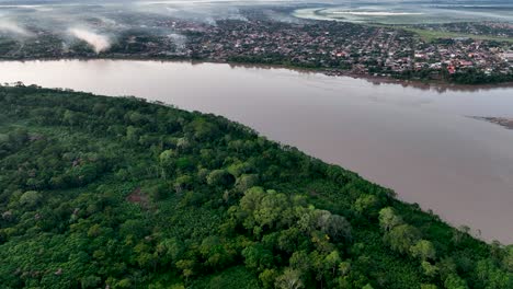 Establishing-Aerial-Fly-Drone-View-of-Riberalta,-Bolivia-with-jungle-amazon-forest-and-main-square