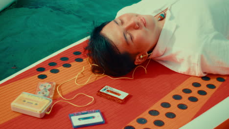 relaxing on a sup with vintage cassette tapes