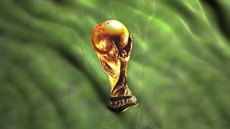 fifa world cup trophy on a green fabric background