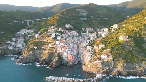 beautiful aerial establishing shot of cinque terre, italy at golden hour