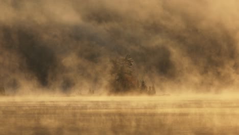 golden hour illuminates morning fog over lake onawa beautiful shot