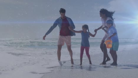animation of light trails over biracial family walking at beach