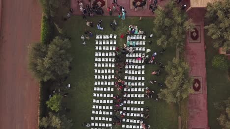 drone top view of the wedding venue in a green field under the tree