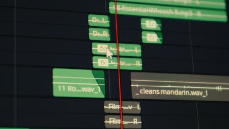 audio track editing in post production working on professional laptop