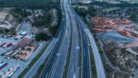 Cinematic-hyperlapse-of-highway-road-with-speeding-cars,-aerial-drone-view