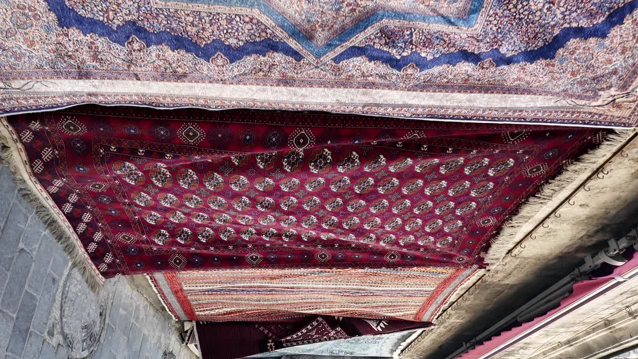 Collection of Intricately Patterned Rugs and Carpets Displayed for Sale