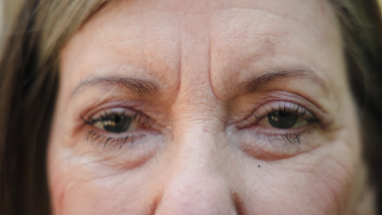 Close-up of senior woman's eyes, reflecting wisdom and life experience, on deck