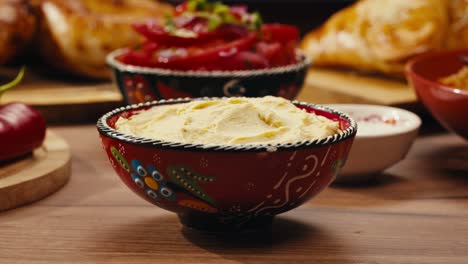 woman serving hummus