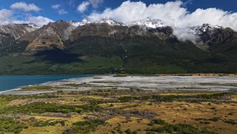 clouds rise and dissapear into air casting shadow across lowlands of south island new zealand