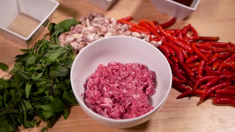 Ingredient-of-Beef-Pad-Kra-Paw,-Stir-Fried-Beef-with-Basil-included-Minced-Beef,-Red-Chili-Pepper,-Garlic,-Ground-White-Pepper-and-Basil-Leave,-Close-Up