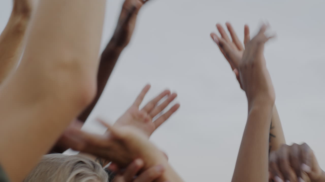 People Raising Hands in Celebration