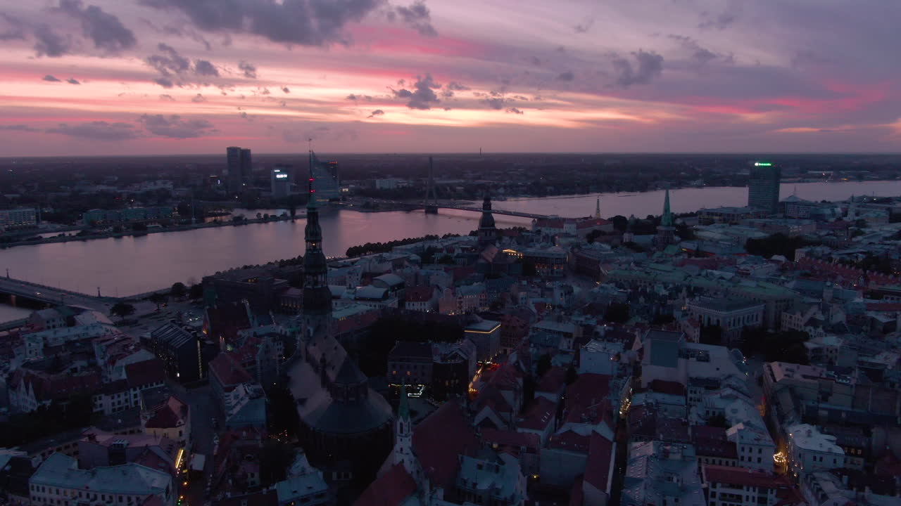 Drone shot of cloud sky on sunset in a big city and bridge over river