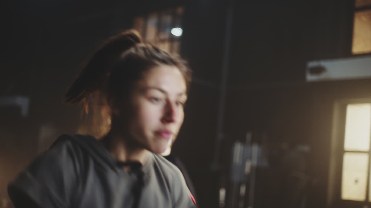 Woman exercising with kettlebell in a gym