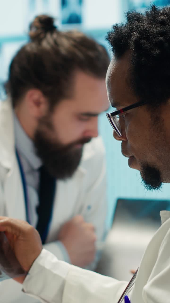 Vertical Video Medical experts analyze radiography scans in a meeting with the staff