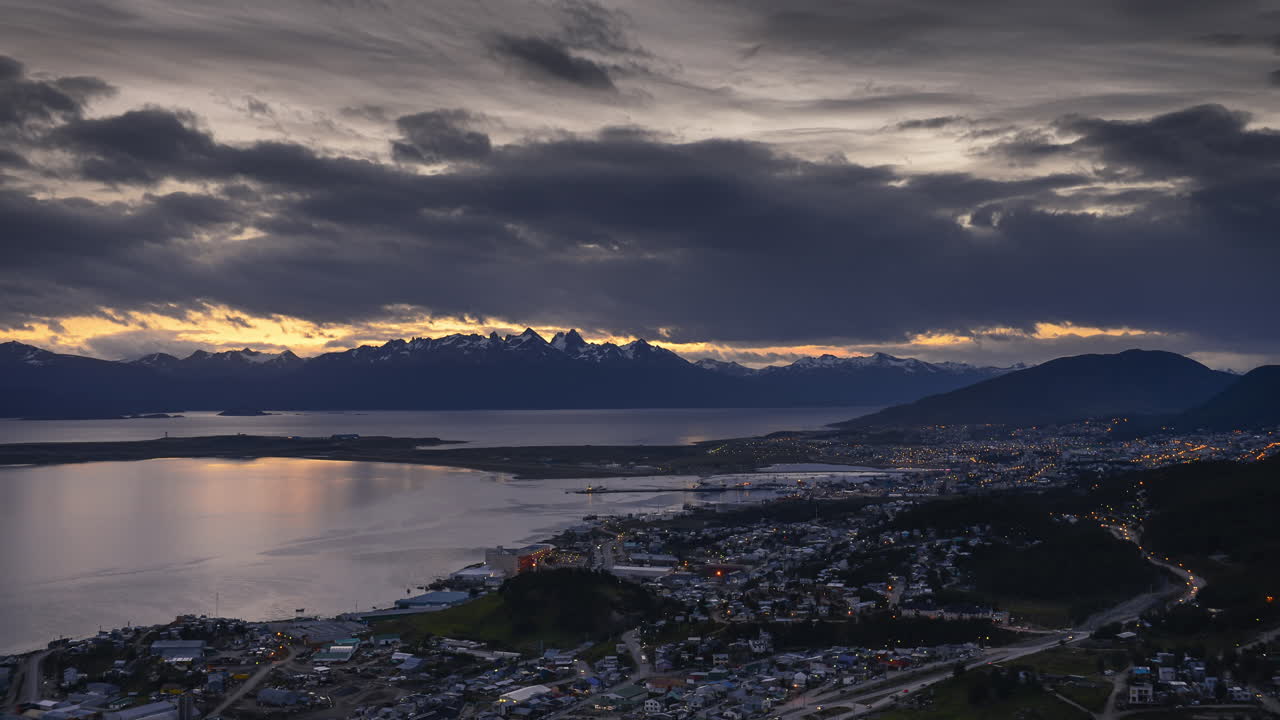 Patagonia Timelapse at Ushuaia of Andes Mountains in Argentina. 4k day to night time lapse of clouds moving over Patagonian landscape at sunset in South America