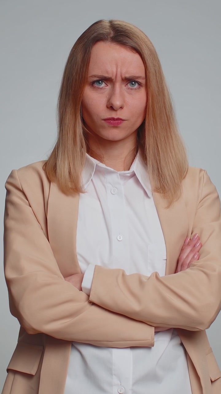 Dissatisfied business woman asking reason of failure expressing disbelief irritation feeling bored