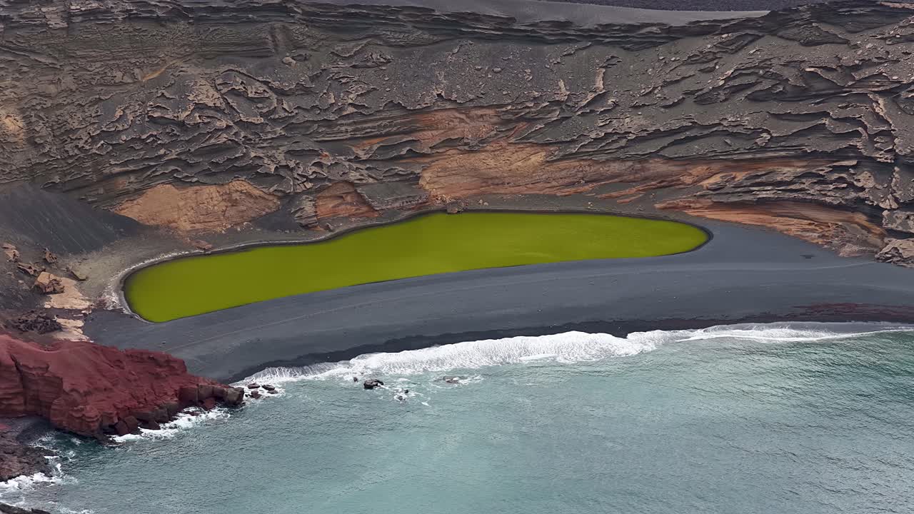 Aerial view of El Golfo, Lanzarote, volcanic beach and green lagoon