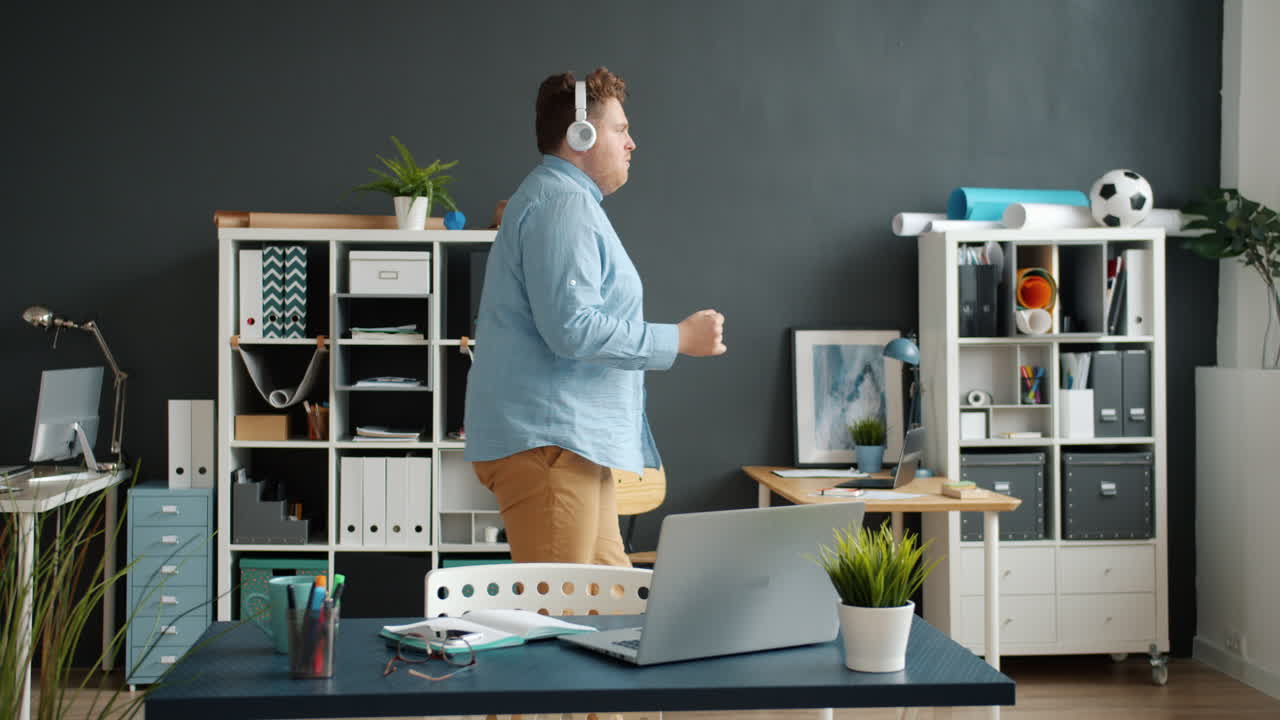 Man Dancing in Office