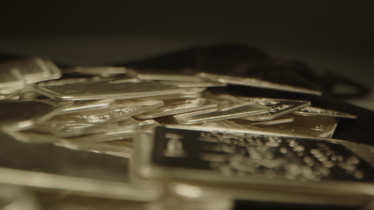 Investment concept: beautiful macro dolly of a lot of silver bars in a studio