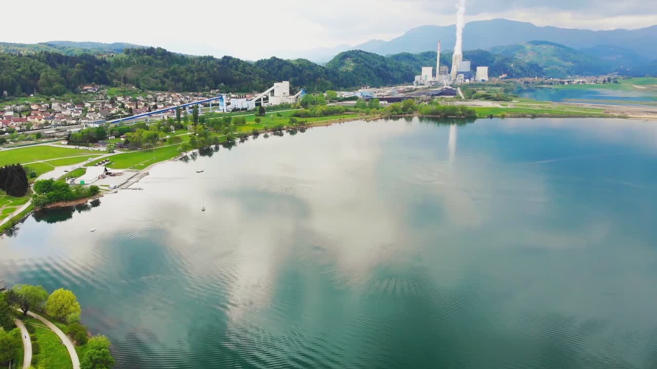 Fly over Velenje Lake towards coal TEŠ Power Station, Slovenia