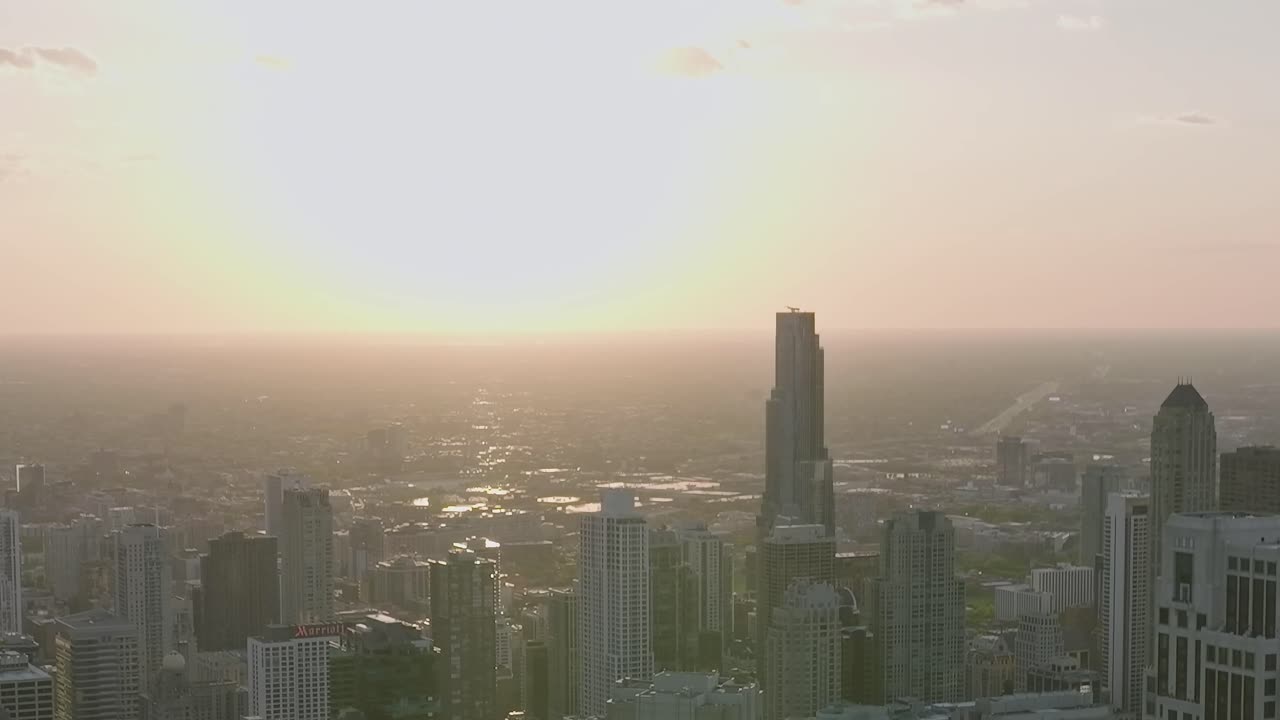 View of city skyline and sunset over Chicago from an aerial perspective