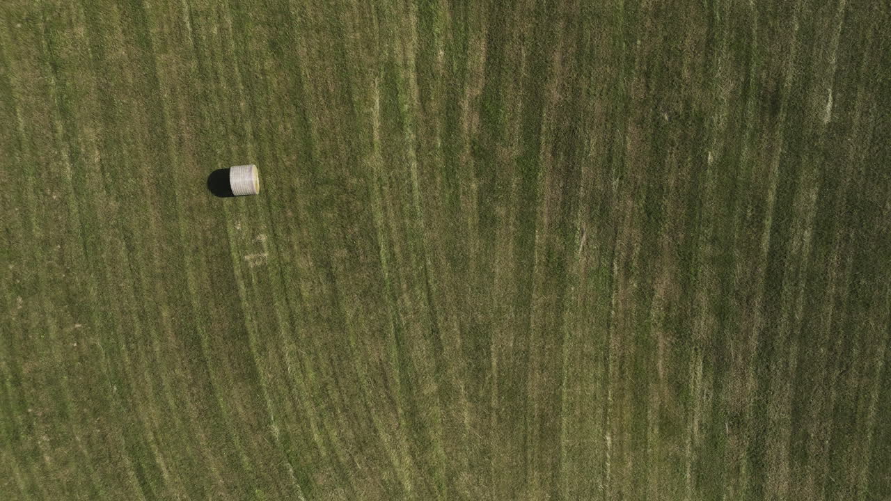 Bird's Eye View Over Field With Round Bale In Oronoco, Minnesota, USA - drone shot