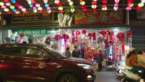 Static-shot-of-shoppers-shopping-at-a-street-market-in-Lang-Son-with-lanterns-hanging