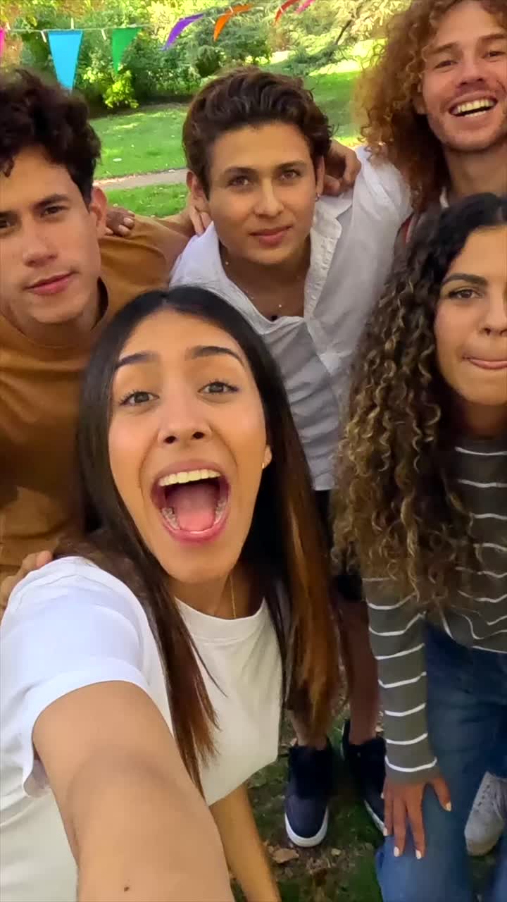 Group of Young Adults Taking a Selfie and Having Fun Together
