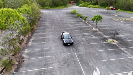 aerial view of car in deserted lot