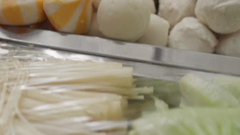 indonesian fish balls for shabu shabu on metal trays