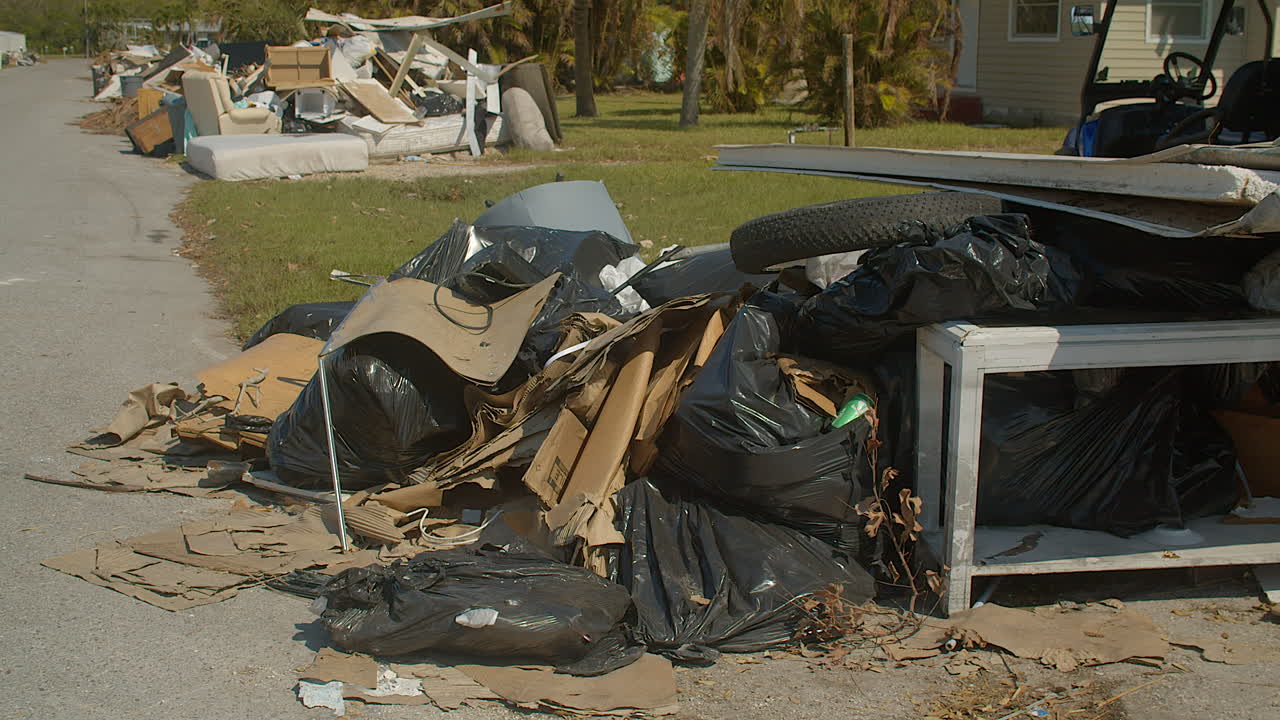 Hurricane debris sits on the street waiting to be picked up. Cortez, Florida