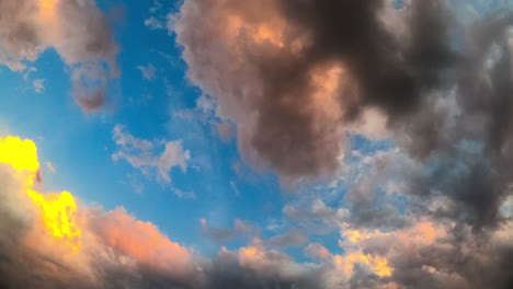 timelapse of colorful clouds at dusk. a captivating timelapse displaying vibrant clouds transitioning from day to night, creating a stunning dusk sky