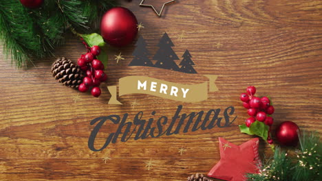 animación de texto de feliz navidad sobre decoraciones de navidad en fondo de madera.