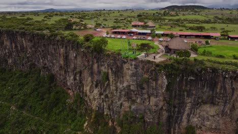 Aerial-shot-of-a-swing-in-a-canyon