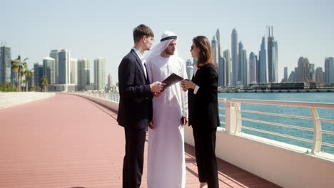 three people talking about business