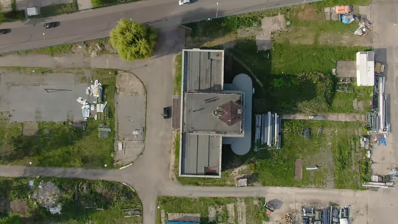 Departing aerial view of an abandoned German building from the God's Eye perspective