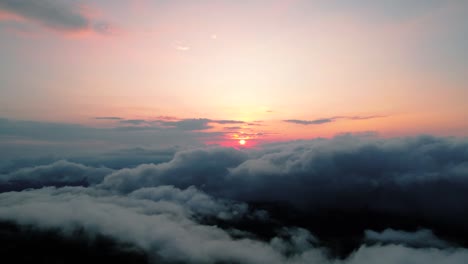 Sunrise-view-from-above-overcast-clouds,-aerial-view
