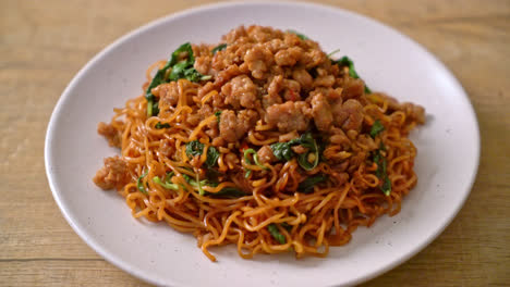 stir-fried instant noodles with thai basil and minced pork - asian food style