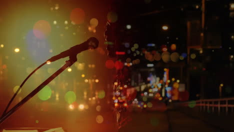 Caucasian-female-singer-singing-and-playing-keyboard-during-concert-over-city-at-night