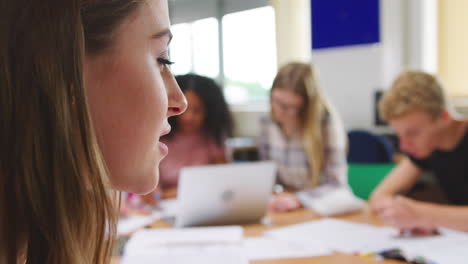 Pull-Focus-Shot-Of-College-Students-Working-In-Library-Together