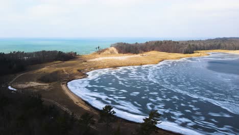 pulling back and lowering over dune harbor near lake michigan