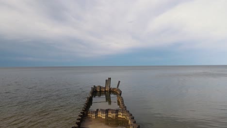 metal rotting pier in lake michigan. forward push