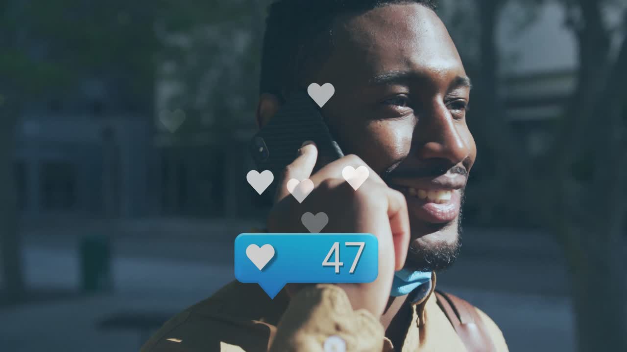 Animation of media icons over man using smartphone