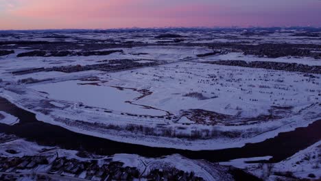 a flying drone's perspective of a beautiful winter sunrise in calgary